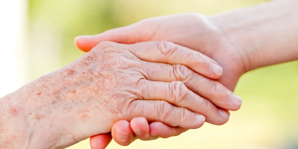 Supportive hand holding between generations