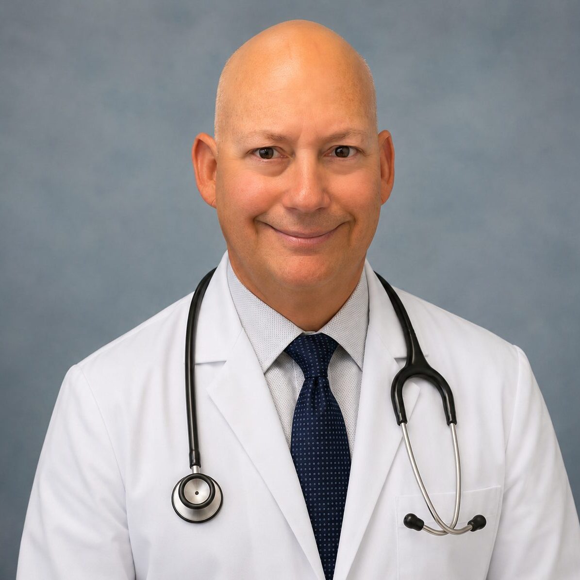 Smiling doctor in white coat with stethoscope